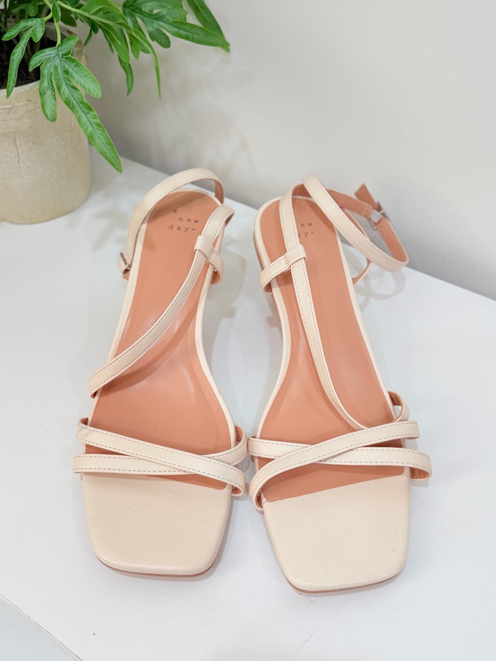 A New Day sandals feature thin straps and a cream
